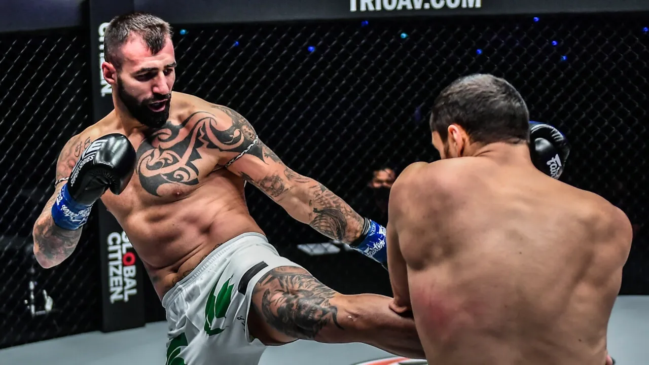 Bogdan Stoica lands a left kick. 