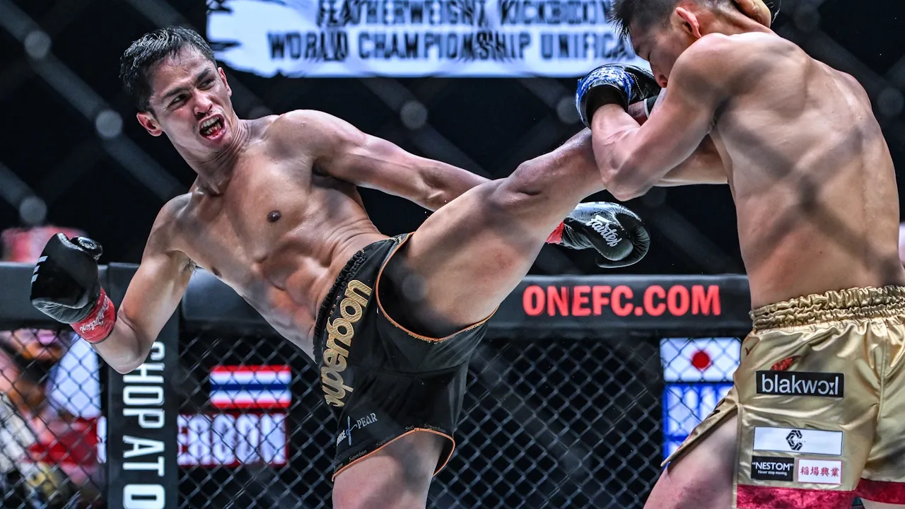 Superbon lands a left kick.